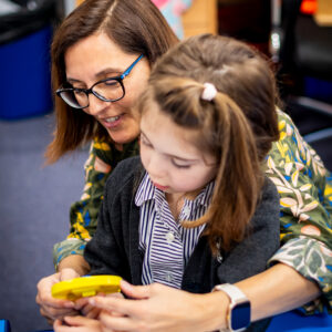 An image of a student and educator working at Devonshire House School, an independent pre-prep and prep school based in London.