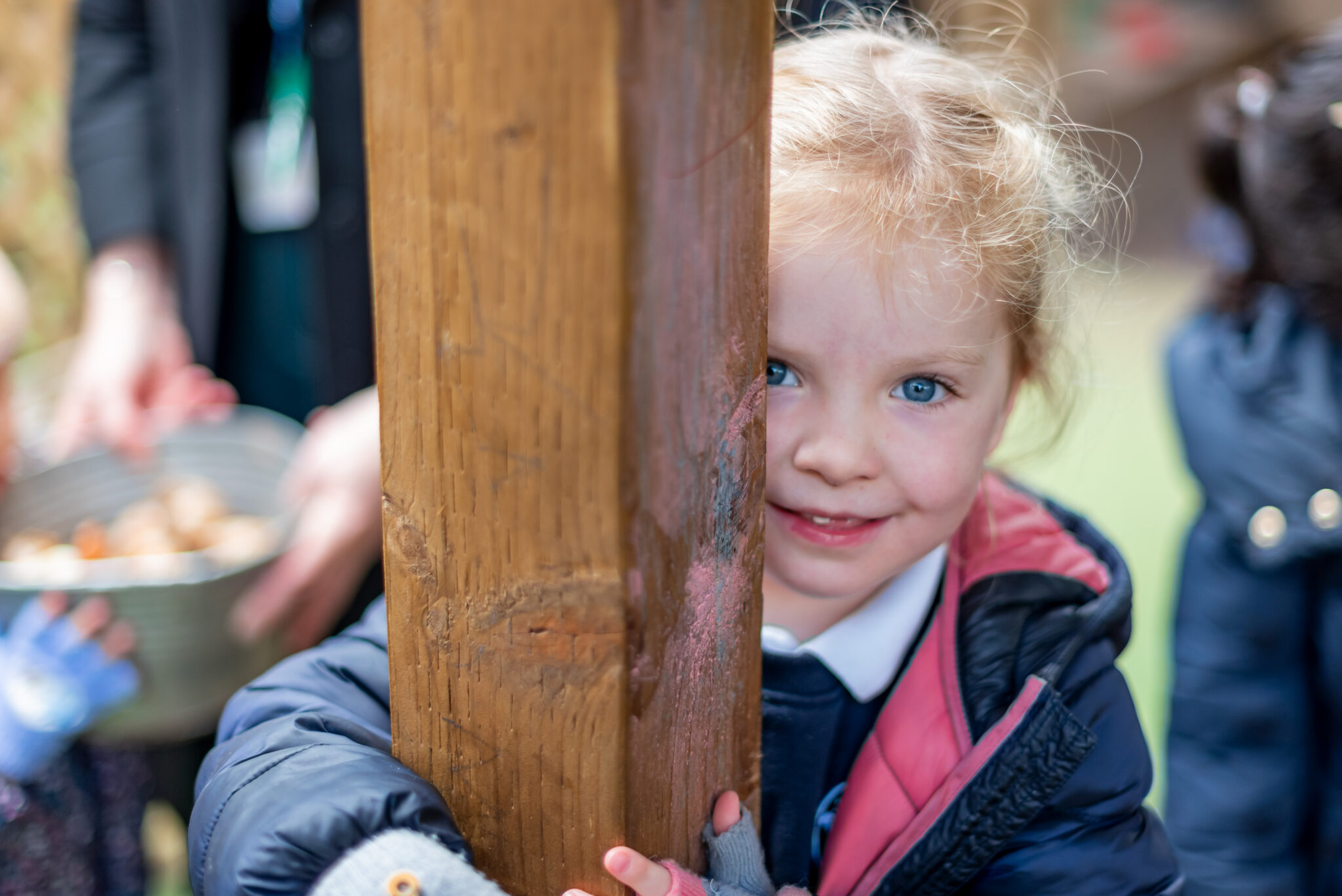 A image of a student smiling at the camera at Devonshire House School, an independent pre-prep and prep school based in London.