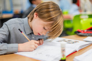 Devonshire House Prep School student writing